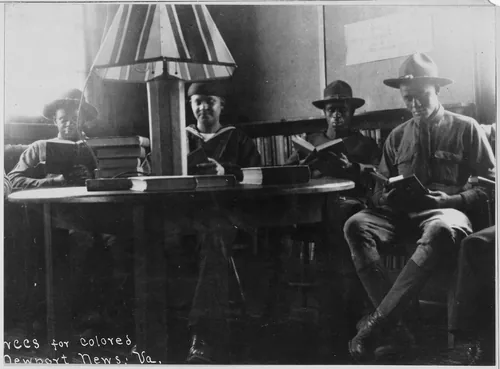 War Camp Community Service. Newport News. Four soldiers seated. American Library Association. Bo